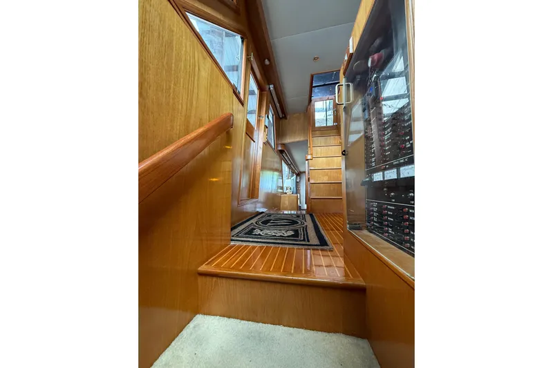 The Dude Yacht Photos Pics Interior of 1995 Ocean Alexander 486 yacht with wooden stairs and elegant design.