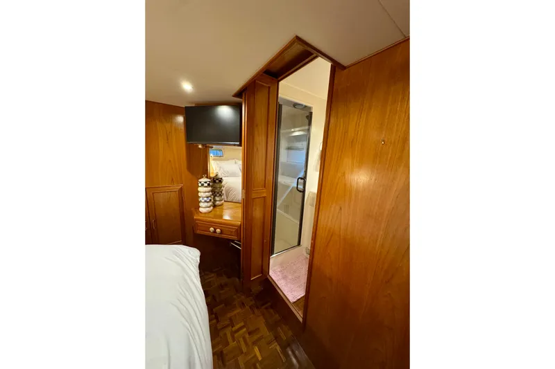 The Dude Yacht Photos Pics Luxurious 1995 Ocean Alexander 486 yacht interior with wood paneling and modern amenities.