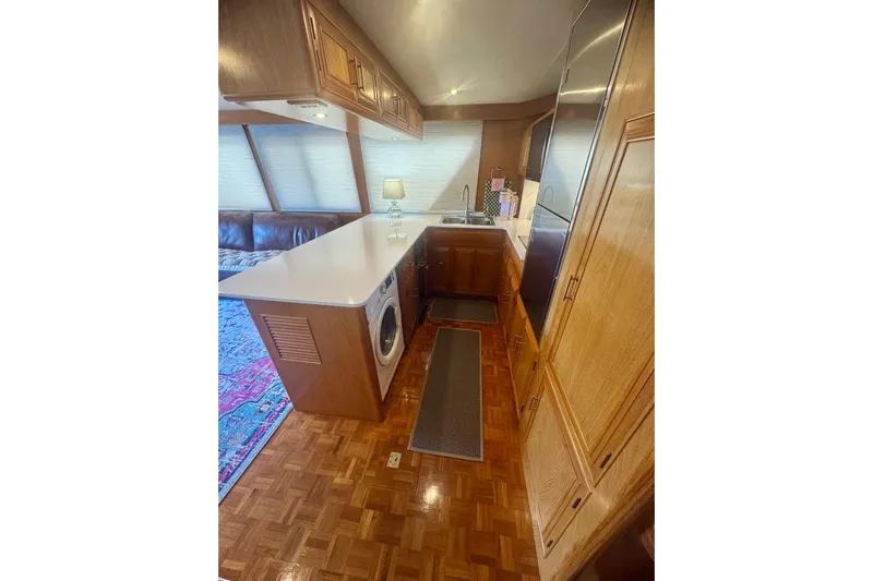 The Dude Yacht Photos Pics Interior of 1995 Ocean Alexander 486 yacht with kitchen and seating area.