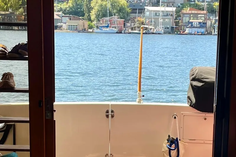 The Dude Yacht Photos Pics View from 1995 Ocean Alexander 486 yacht, overlooking serene waterfront and houses.