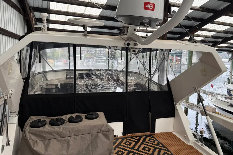 The Dude Yacht Photos Pics 1995 Ocean Alexander 486 yacht interior with covered cockpit and radar equipment.