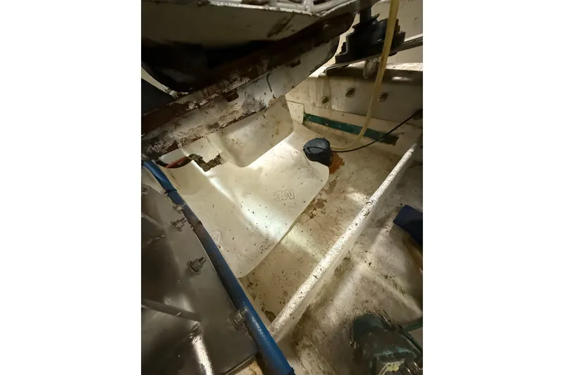 The Dude Yacht Photos Pics Engine room of 1995 Ocean Alexander 486 yacht, showing mechanical components and piping.