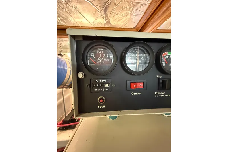 The Dude Yacht Photos Pics Control panel of a 1995 Ocean Alexander 486 yacht, featuring gauges and switches.