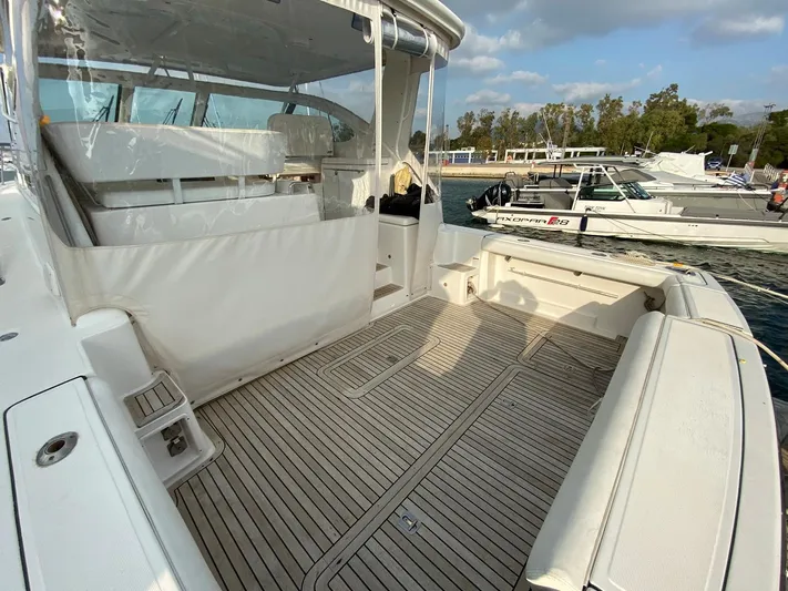  Yacht Photos Pics 2006 Tiara Yachts 42 model with spacious deck, docked at marina.