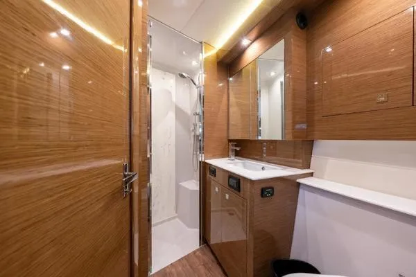  Yacht Photos Pics Luxurious bathroom interior of 2018 Cruisers Yachts 50 Cantius with modern wood finish.