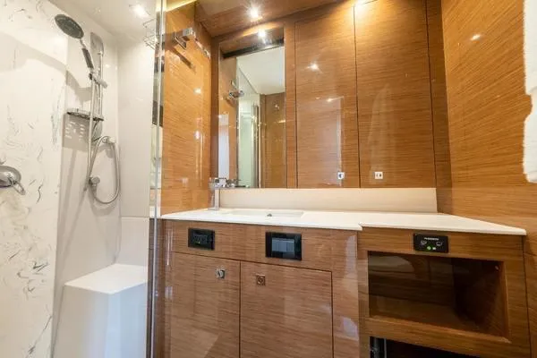  Yacht Photos Pics Luxurious bathroom interior of 2018 Cruisers Yachts 50 Cantius with modern fixtures.