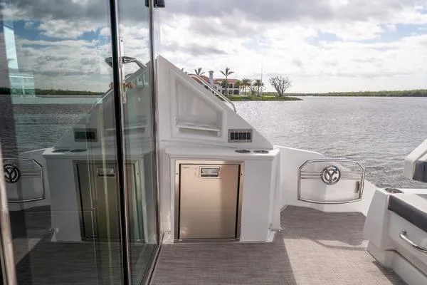  Yacht Photos Pics 2018 Cruisers Yachts 50 Cantius deck with scenic water view and modern amenities.