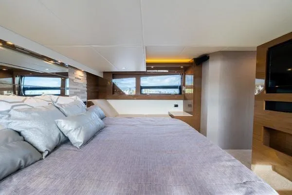  Yacht Photos Pics Luxurious bedroom interior of 2018 Cruisers Yachts 50 Cantius with modern design and large windows.