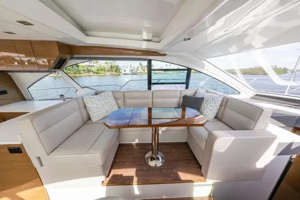  Yacht Photos Pics Luxurious interior of 2018 Cruisers Yachts 50 Cantius with elegant seating and scenic water view.