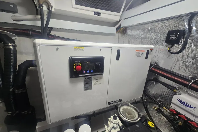  Yacht Photos Pics Engine room of 2018 Cruisers Yachts 50 Cantius with Kohler generator.