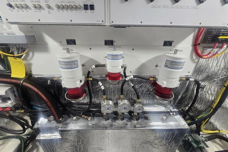  Yacht Photos Pics Engine room of 2018 Cruisers Yachts 50 Cantius with fuel filters and control panel.