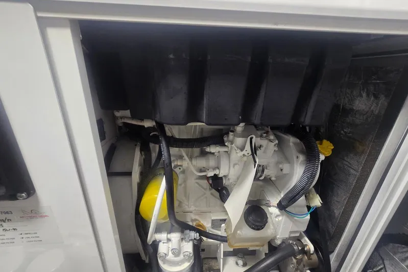  Yacht Photos Pics Engine compartment of 2018 Cruisers Yachts 50 Cantius, showcasing mechanical components.