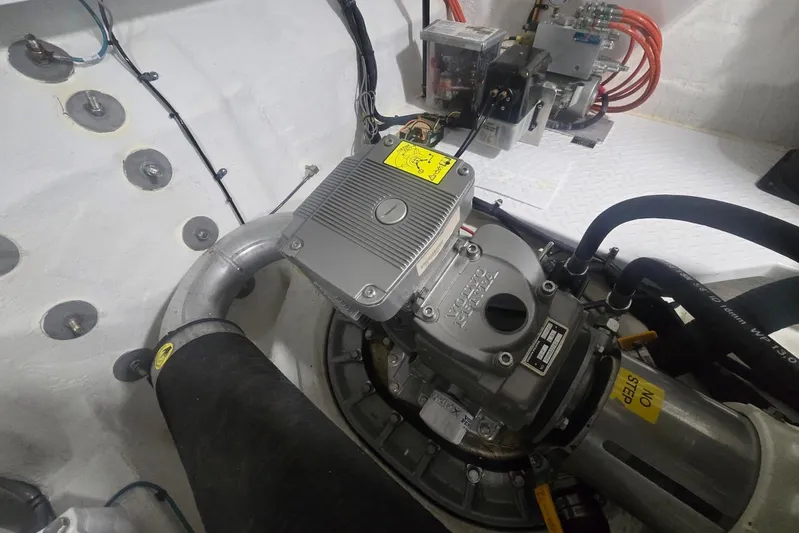  Yacht Photos Pics Engine compartment of 2018 Cruisers Yachts 50 Cantius with visible mechanical components.