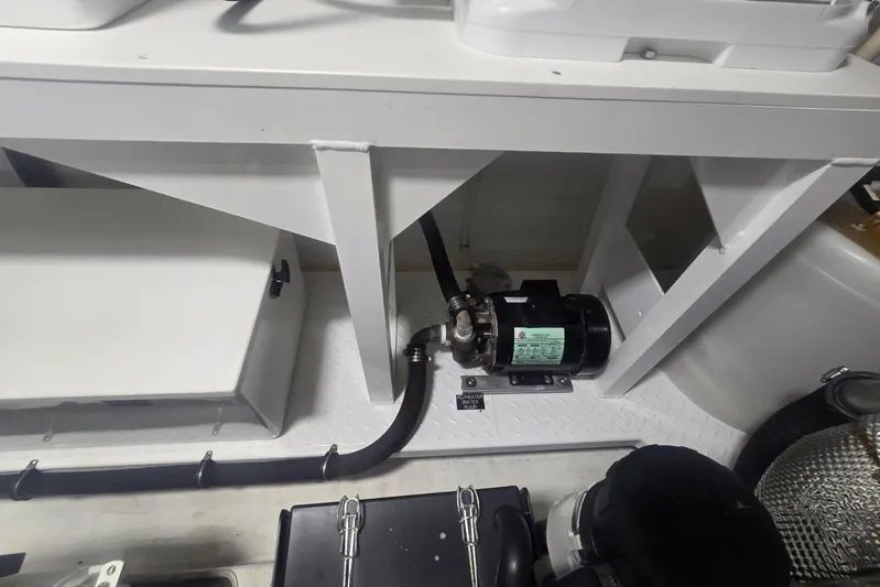  Yacht Photos Pics Engine compartment of 2018 Cruisers Yachts 50 Cantius, featuring mechanical components and piping.