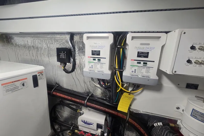  Yacht Photos Pics Engine room of 2018 Cruisers Yachts 50 Cantius with ProNautic battery chargers.