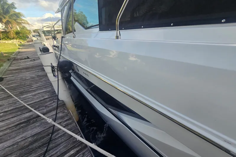  Yacht Photos Pics 2018 Cruisers Yachts 50 Cantius docked, showcasing sleek white exterior and modern design.