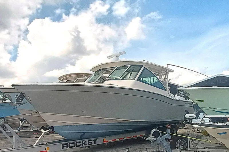 335-712 Used Yacht Photos Pics 2021 Grady-White Freedom 375 boat on trailer under cloudy sky.