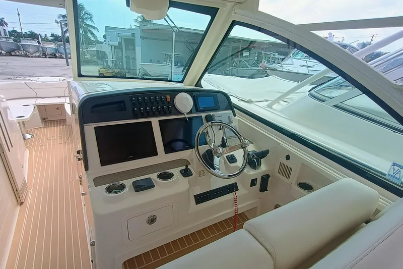 335-712 Used Yacht Photos Pics 2021 Grady-White Freedom 375 boat cockpit with modern controls and steering wheel.