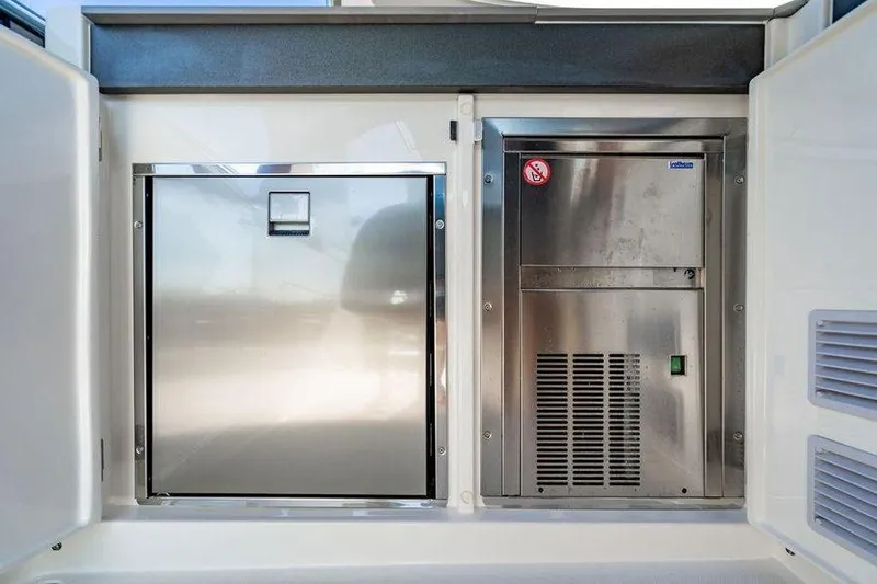  Yacht Photos Pics Stainless steel appliances on 2022 Absolute 64 Navetta yacht, featuring modern design and functionality.