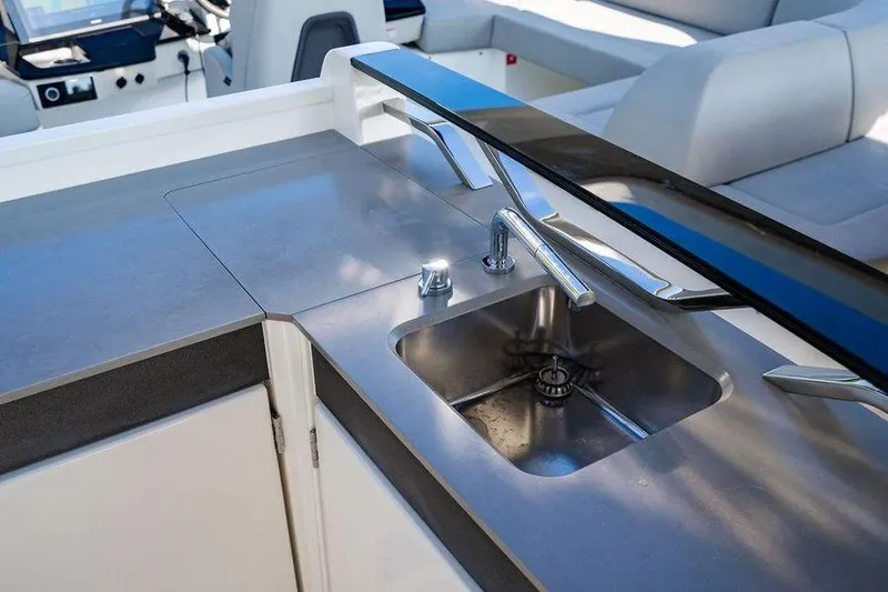  Yacht Photos Pics Luxury yacht kitchen area with modern sink, Absolute 64 Navetta 2022 model.