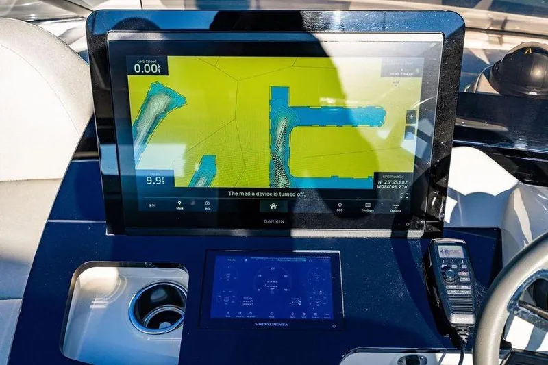  Yacht Photos Pics Navigation display on 2022 Absolute 64 Navetta yacht, featuring Garmin GPS and control panel.