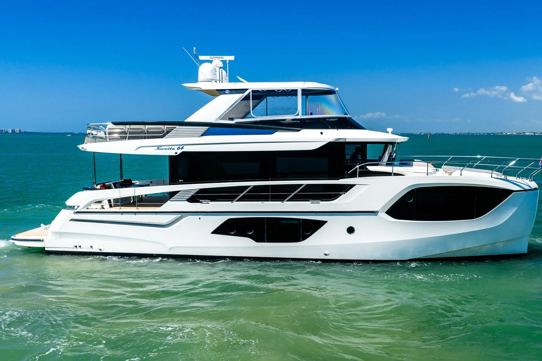 Luxury Absolute 64 Navetta yacht cruising on clear blue waters, 2022 model.