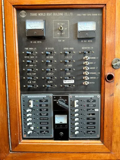 Whiskey River Yacht Photos Pics Electrical control panel of a 1981 Island Trader 46 boat, featuring various switches and meters.