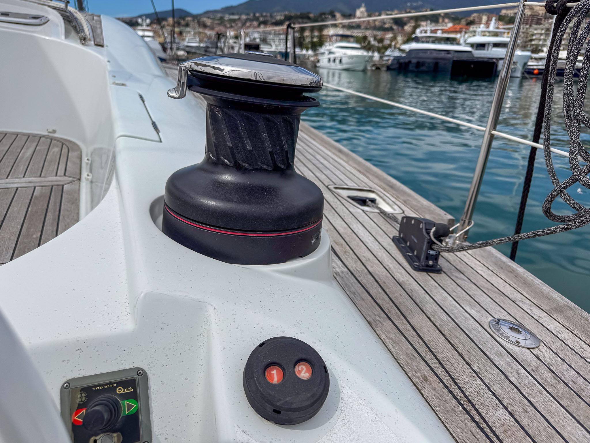 Sailing yacht deck of 2020 Comar Comet 62 RS, featuring winch and control panel.
