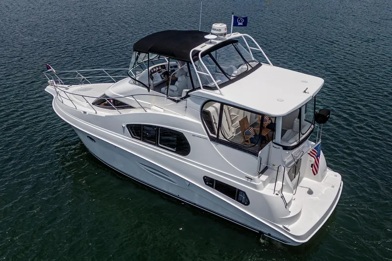 At Ease Yacht Photos Pics 2004 Silverton 39 Motor Yacht cruising on calm waters.