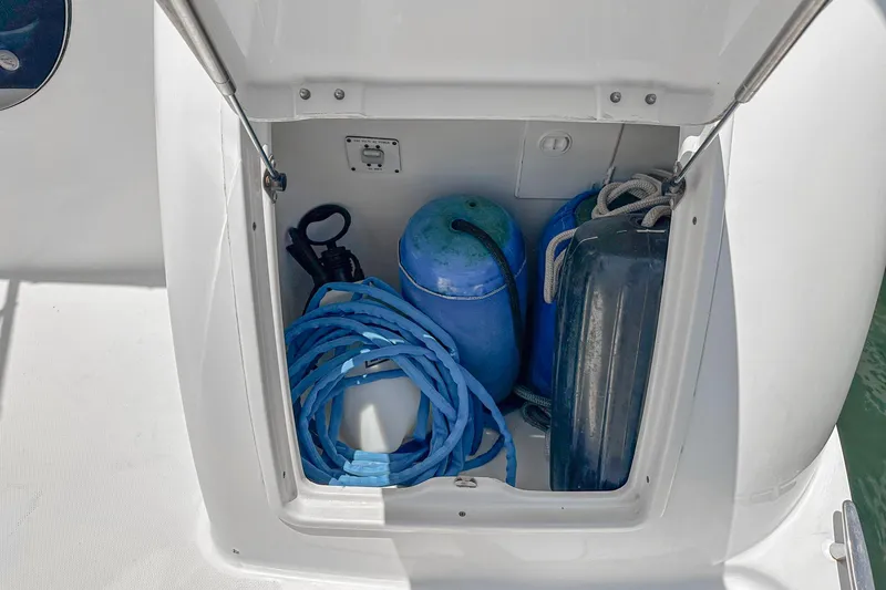 At Ease Yacht Photos Pics Storage compartment on a 2004 Silverton 39 Motor Yacht with blue ropes and fenders.