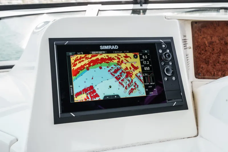 At Ease Yacht Photos Pics Simrad navigation display on 2004 Silverton 39 Motor Yacht dashboard.