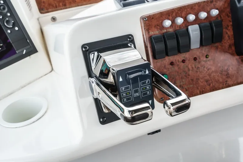 At Ease Yacht Photos Pics Control panel of a 2004 Silverton 39 Motor Yacht with chrome throttle levers.