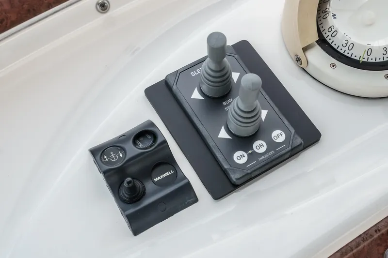 At Ease Yacht Photos Pics Control panel of a 2004 Silverton 39 Motor Yacht with joysticks and switches.