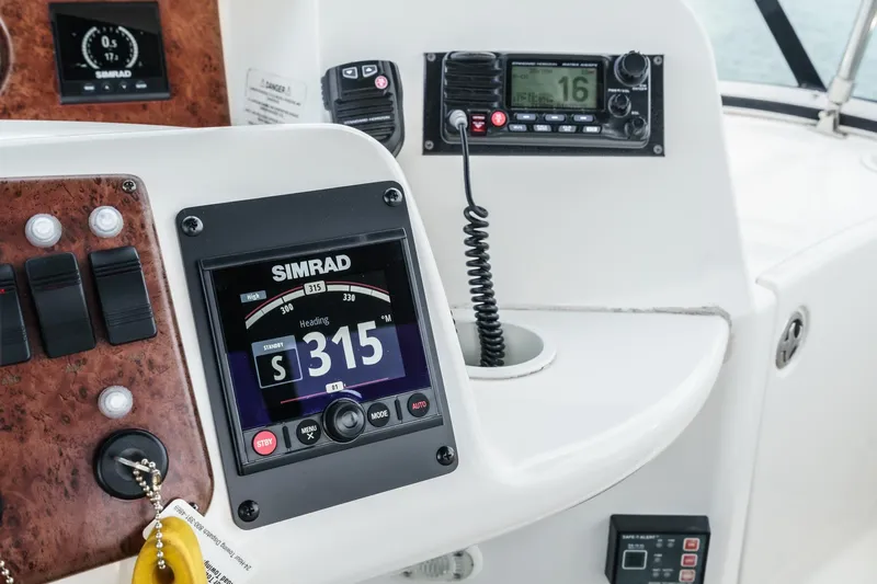 At Ease Yacht Photos Pics 2004 Silverton 39 Motor Yacht helm with Simrad navigation and communication equipment.