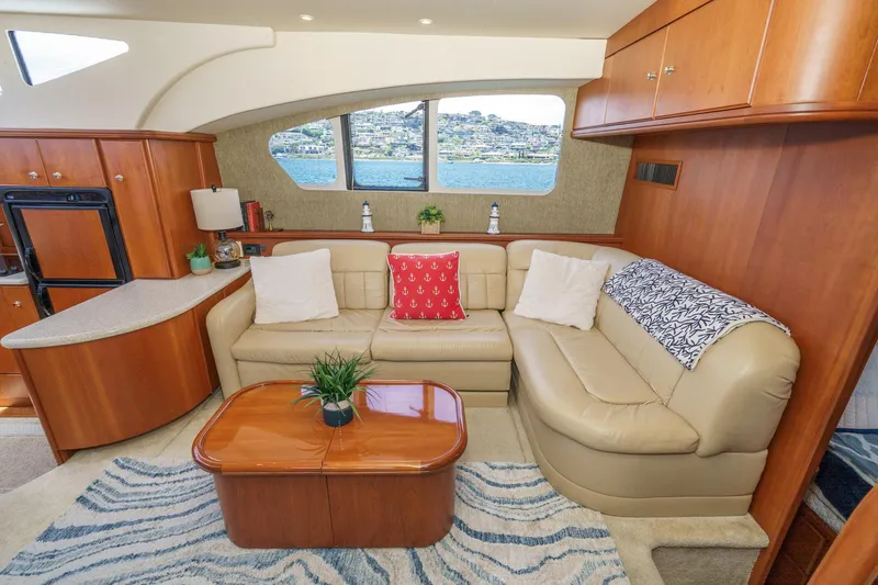At Ease Yacht Photos Pics Luxurious interior of 2004 Silverton 39 Motor Yacht with plush seating and elegant decor.