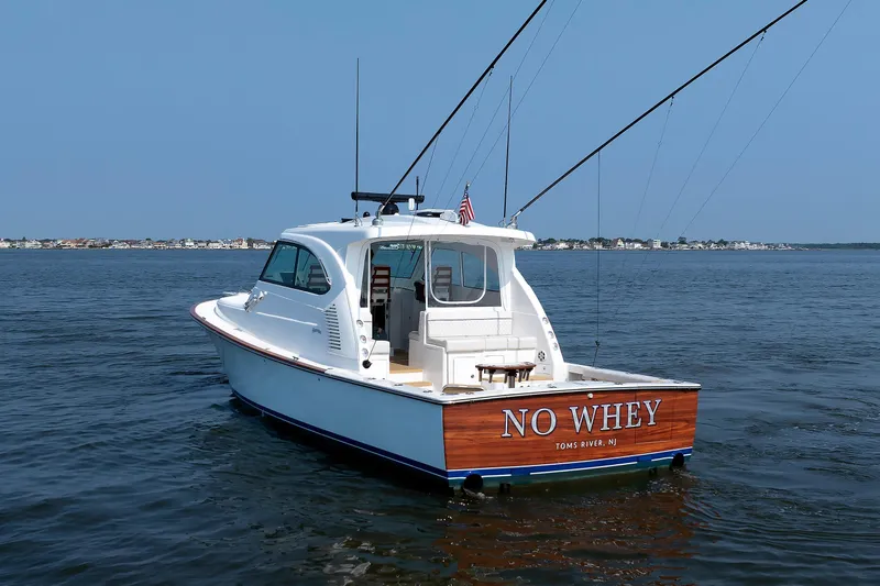 No Whey Yacht Photos Pics 2023 Henriques 42 Express Hardtop boat on water, rear view, "No Whey" name visible.