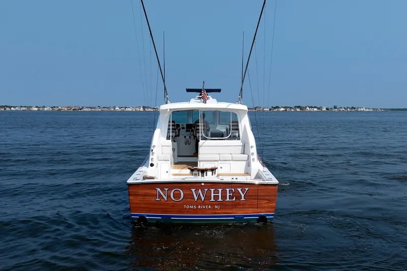 No Whey Yacht Photos Pics 2023 Henriques 42 Express Hardtop boat named "No Whey" on open water.