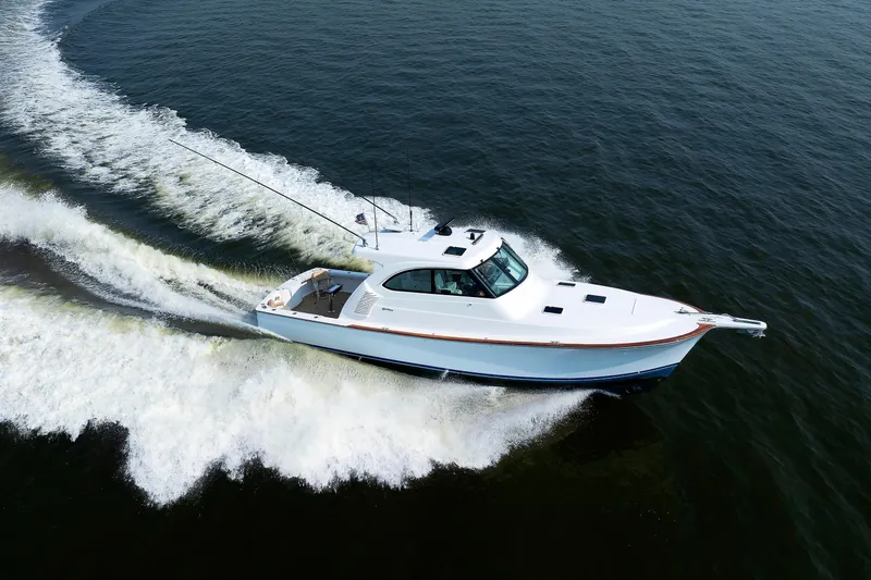 No Whey Yacht Photos Pics 2023 Henriques 42 Express Hardtop cruising on open water, creating a dynamic wake.