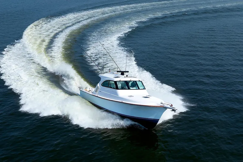 No Whey Yacht Photos Pics 2023 Henriques 42 Express Hardtop cruising on open water, creating a dynamic wake.