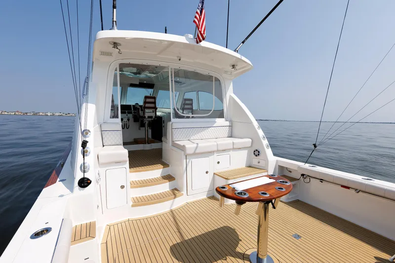 No Whey Yacht Photos Pics 2023 Henriques 42 Express Hardtop yacht interior with seating and fishing setup.