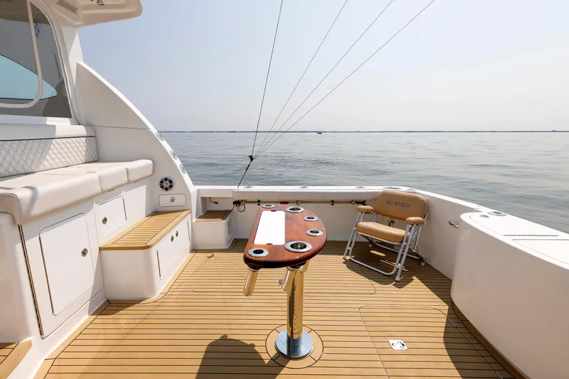 No Whey Yacht Photos Pics 2023 Henriques 42 Express Hardtop boat deck with seating and ocean view.