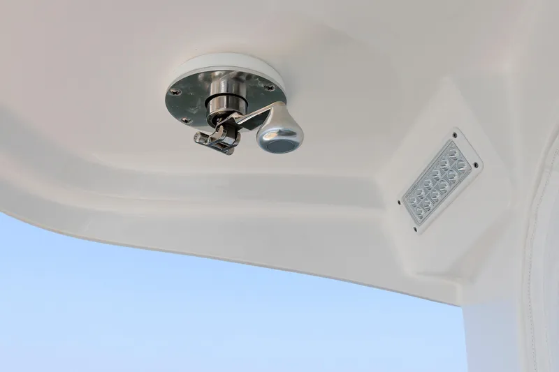 No Whey Yacht Photos Pics 2023 Henriques 42 Express Hardtop interior detail with light fixture and handle.