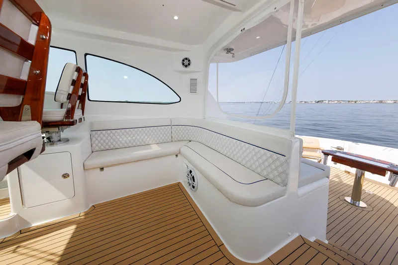 No Whey Yacht Photos Pics 2023 Henriques 42 Express Hardtop interior with elegant seating and ocean view.