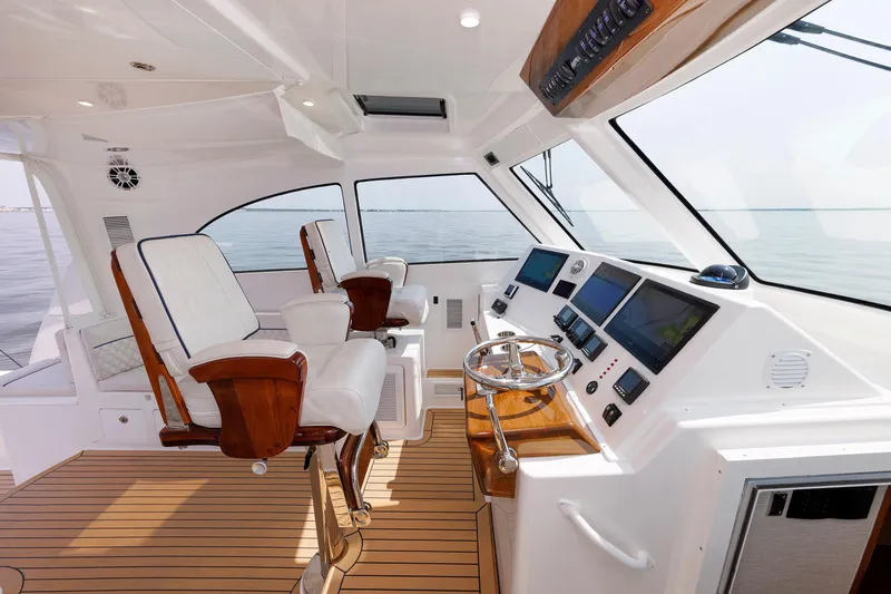 No Whey Yacht Photos Pics 2023 Henriques 42 Express Hardtop yacht interior with modern helm and seating.