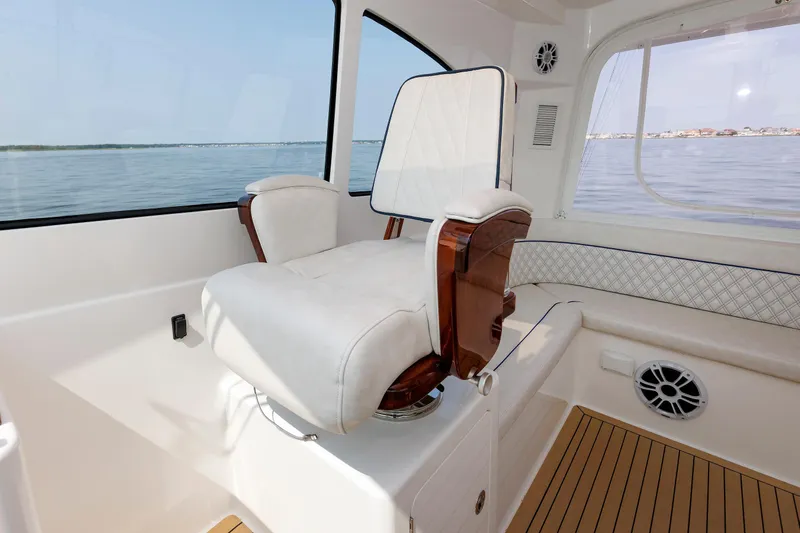 No Whey Yacht Photos Pics Luxury seating on 2023 Henriques 42 Express Hardtop yacht interior, overlooking serene waters.