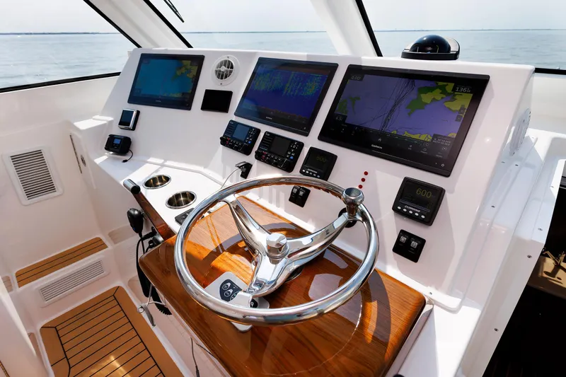 No Whey Yacht Photos Pics Helm of 2023 Henriques 42 Express Hardtop with advanced navigation displays and controls.