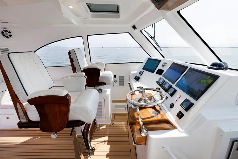 No Whey Yacht Photos Pics 2023 Henriques 42 Express Hardtop helm with dual seats and advanced navigation displays.