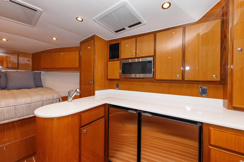 No Whey Yacht Photos Pics Luxurious interior of 2023 Henriques 42 Express Hardtop yacht with modern kitchen amenities.