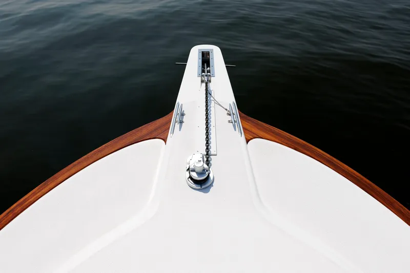 No Whey Yacht Photos Pics Bow of 2023 Henriques 42 Express Hardtop yacht with anchor chain over water.