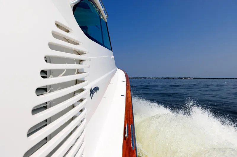 No Whey Yacht Photos Pics 2023 Henriques 42 Express Hardtop cruising on open water, side view.